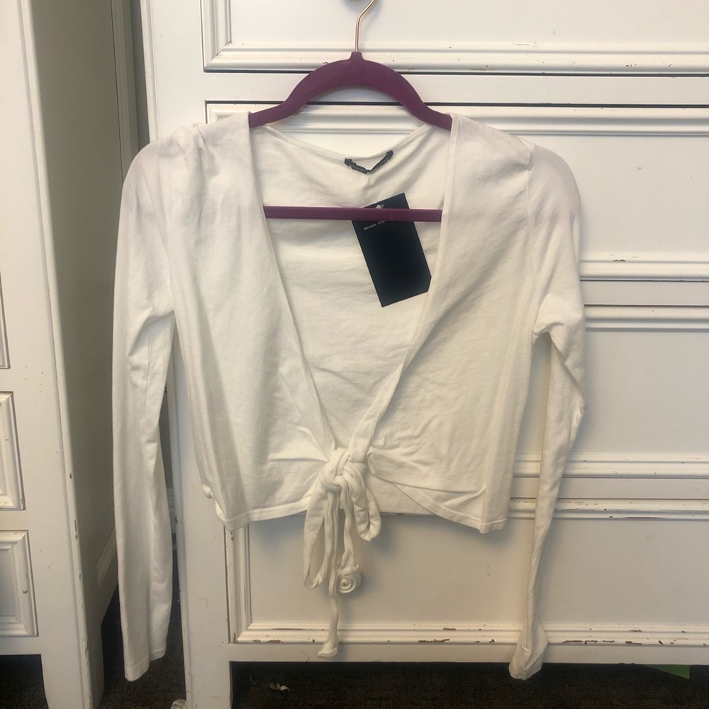 White long sleeve tee with an open tie front